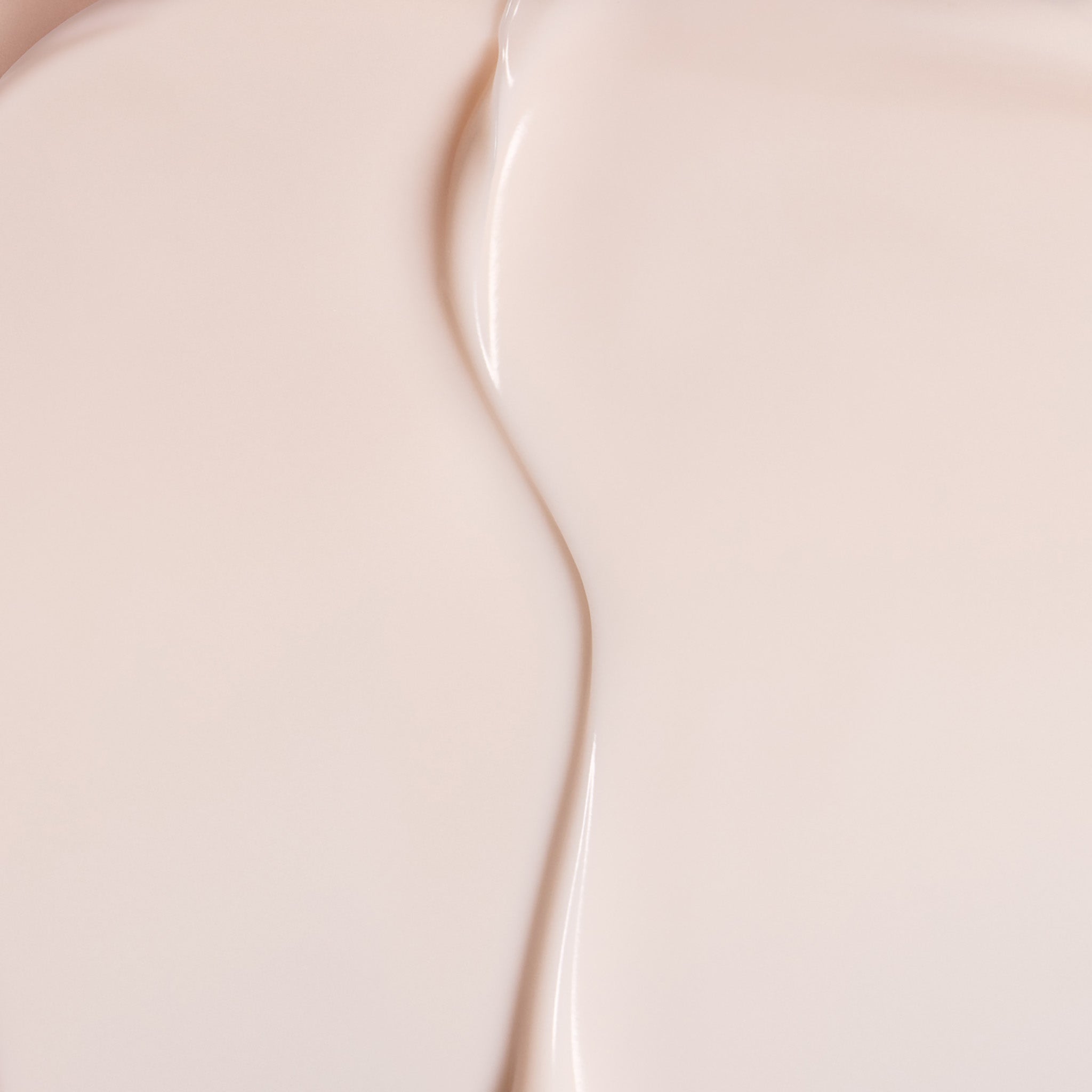 Close-up of The Body Shop Vitamin E Day cream with a subtle gradient.