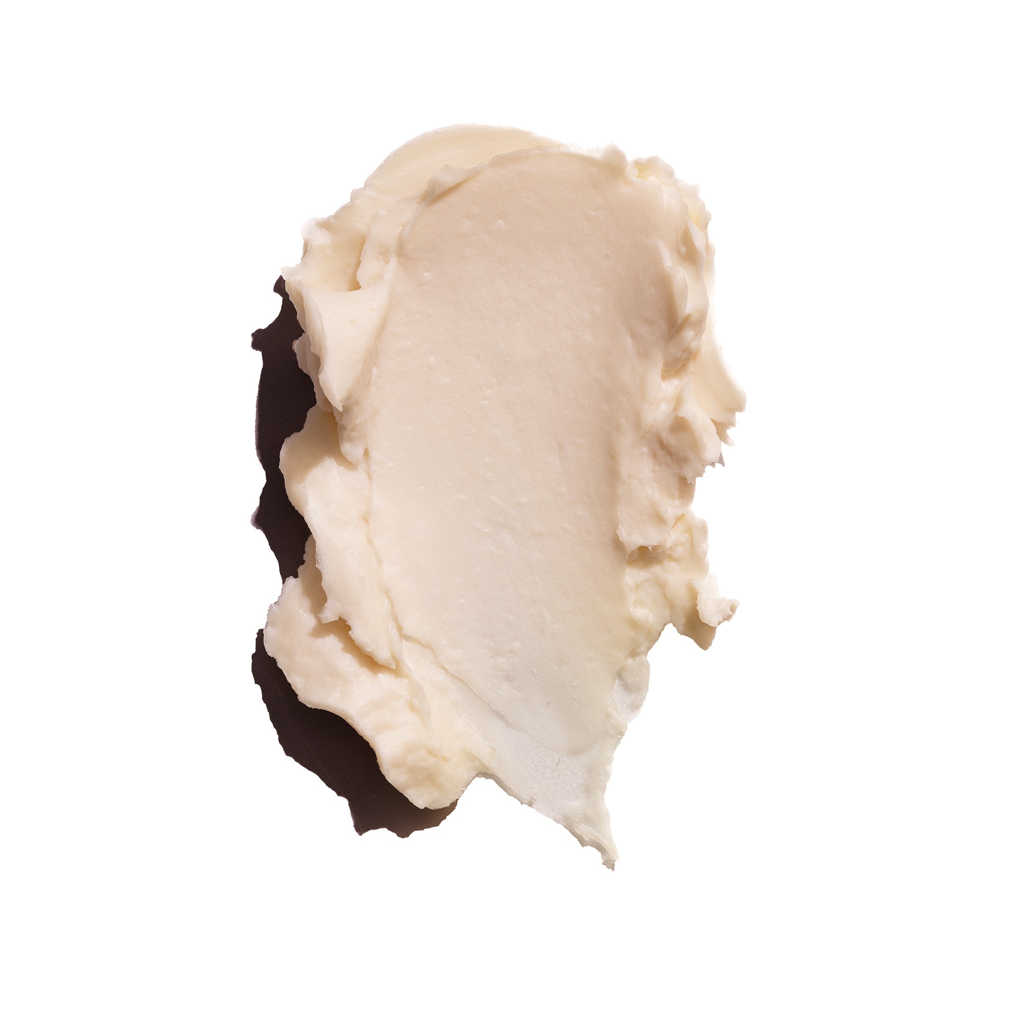 Close up image of The Body Shop Coconut Body Butter texture on a white background