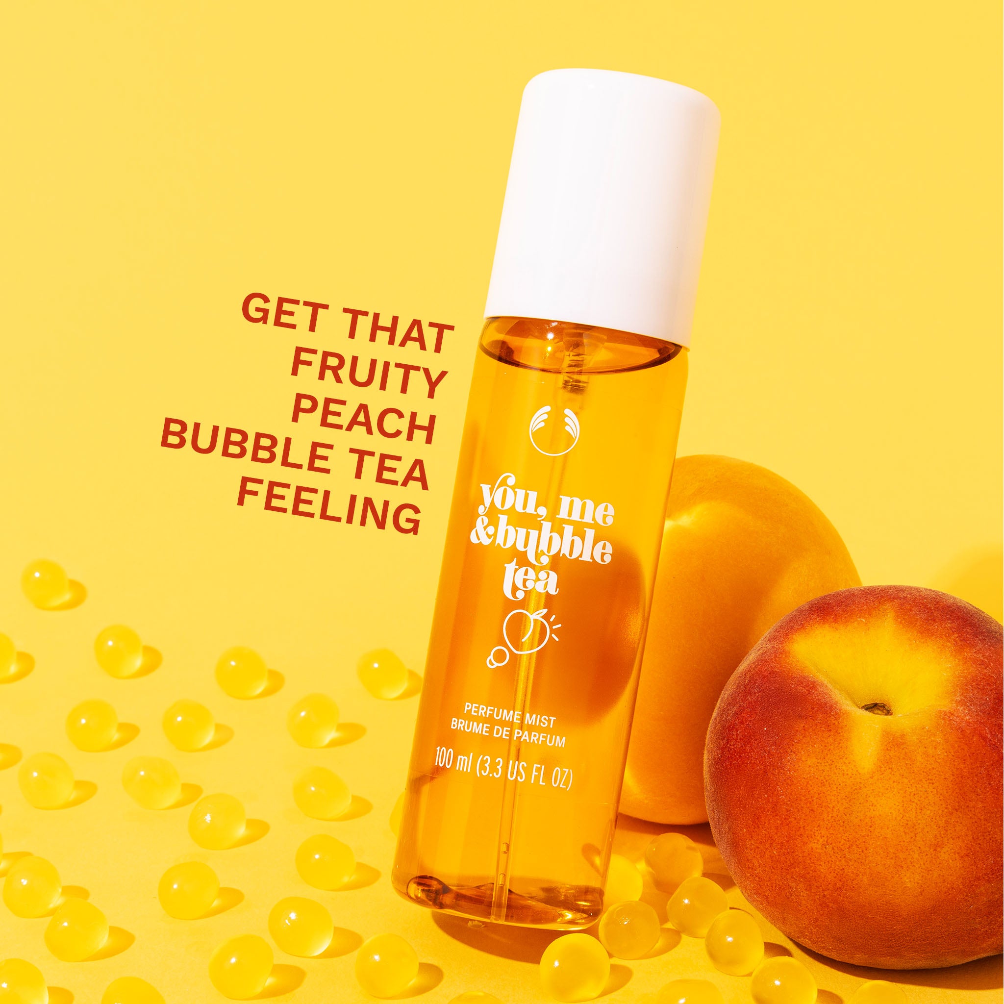 You, Me & Bubble Tea Fragrance Mist - The Body Shop, leaning against two peaches. Overlay text 'Get that fruity peach bubble tea feeling'.